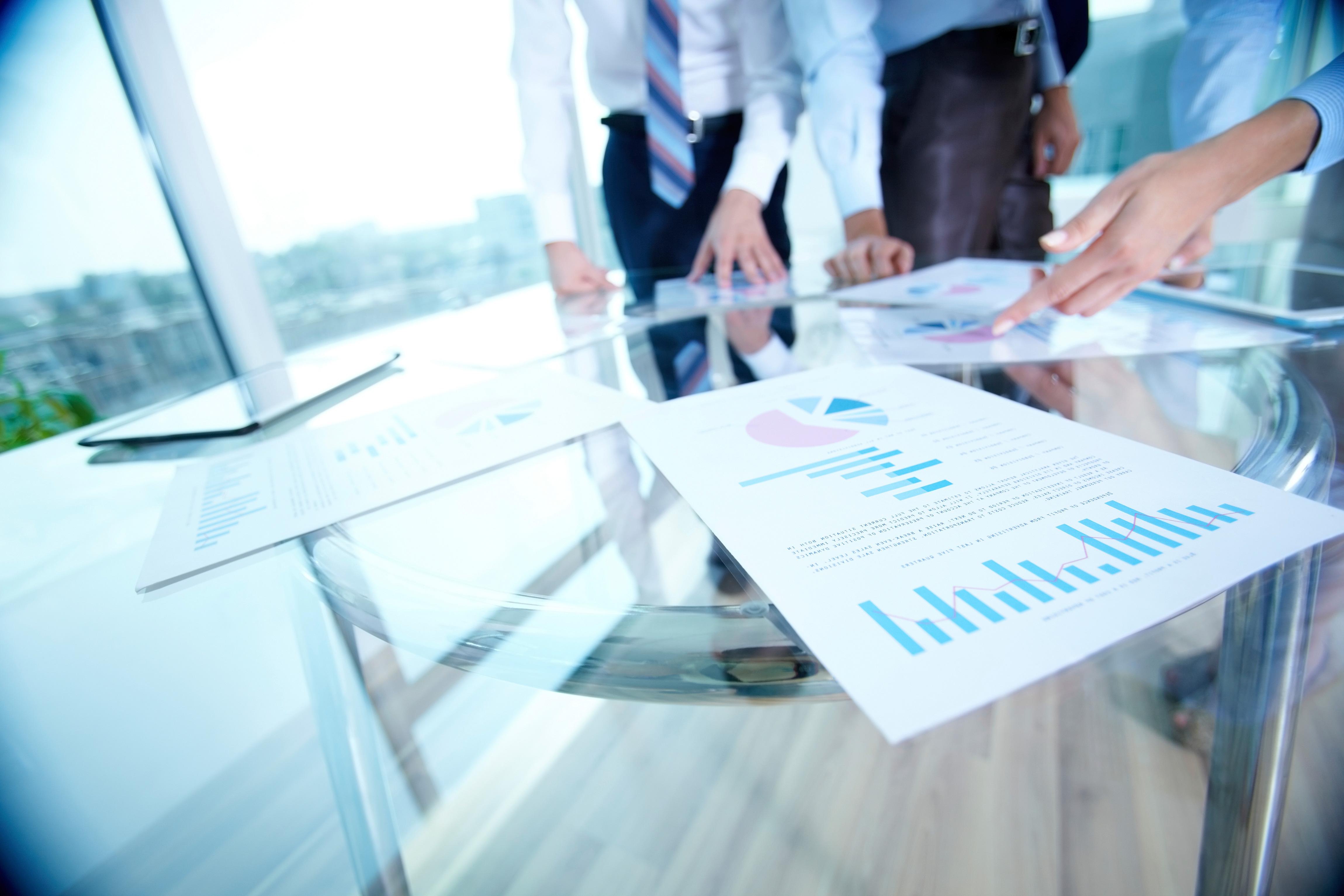 Meeting and documents on a table